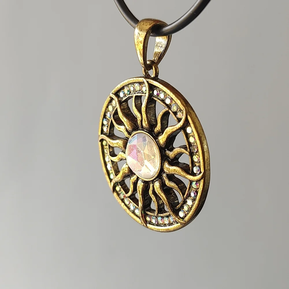 Radiant Gold Sunburst Necklace with Central Gem